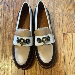 Coach Tan and White Flats with Stylish Metal Accents